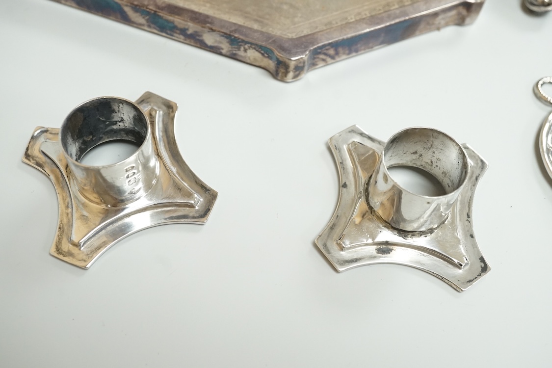 A late 19th century French small white metal Holy Water stoop, 11.4cm, together with a Victorian silver and leather mounted glass hip flask(a.f.), a late Victorian silver 'grenade' lighter by Sampson Mordan & Co, two sil